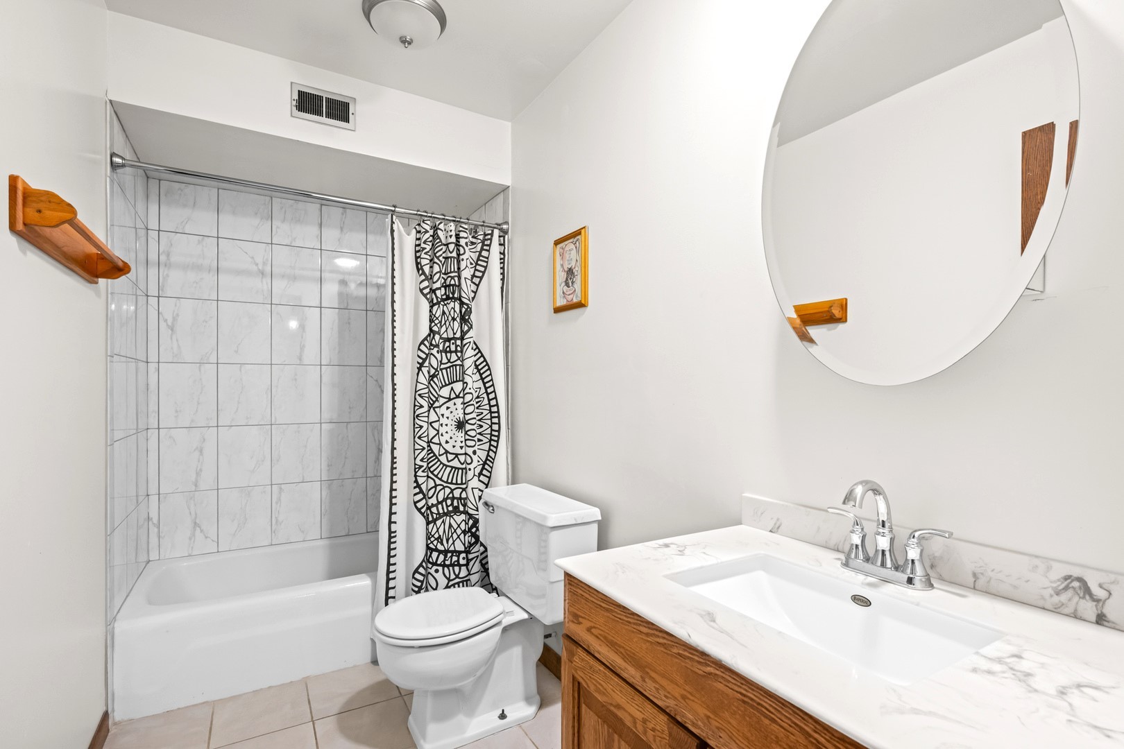 1472 Carol Court, Unit 1A Palatine, IL 60074 - Photo 5 of 11 a bathroom with a sink toilet and shower