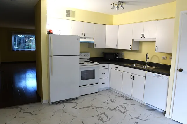 a kitchen with a sink and cabinets