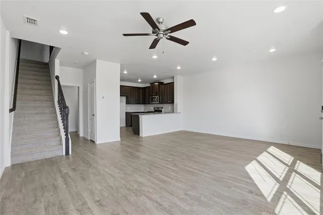 a view of kitchen and wooden floor