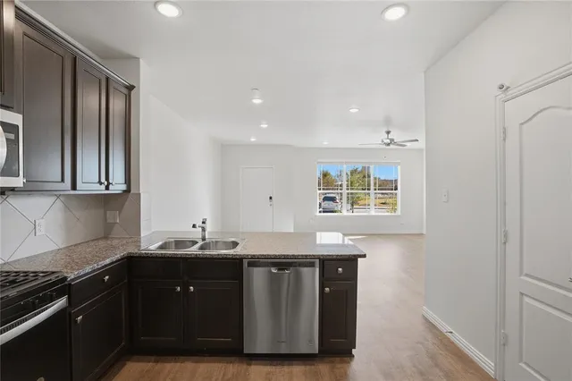 a kitchen with a sink and cabinets