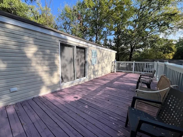 a view of a wooden deck with a patio