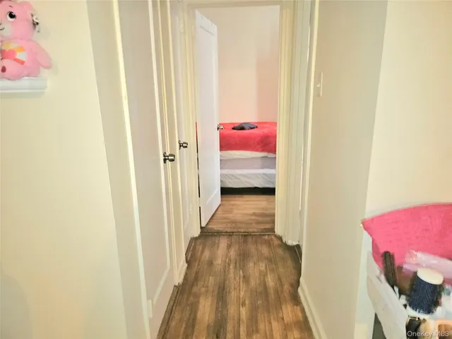 a view of a room with wooden floor