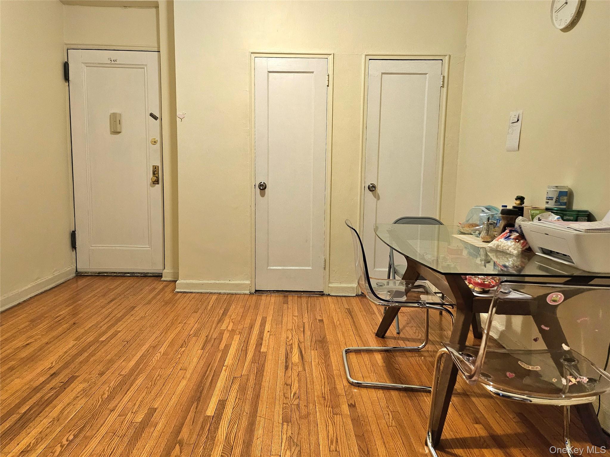 112-25 34th Avenue, Unit H Queens, NY 11368 - Photo 8 of 20 a view of a room that has a table and chairs in it