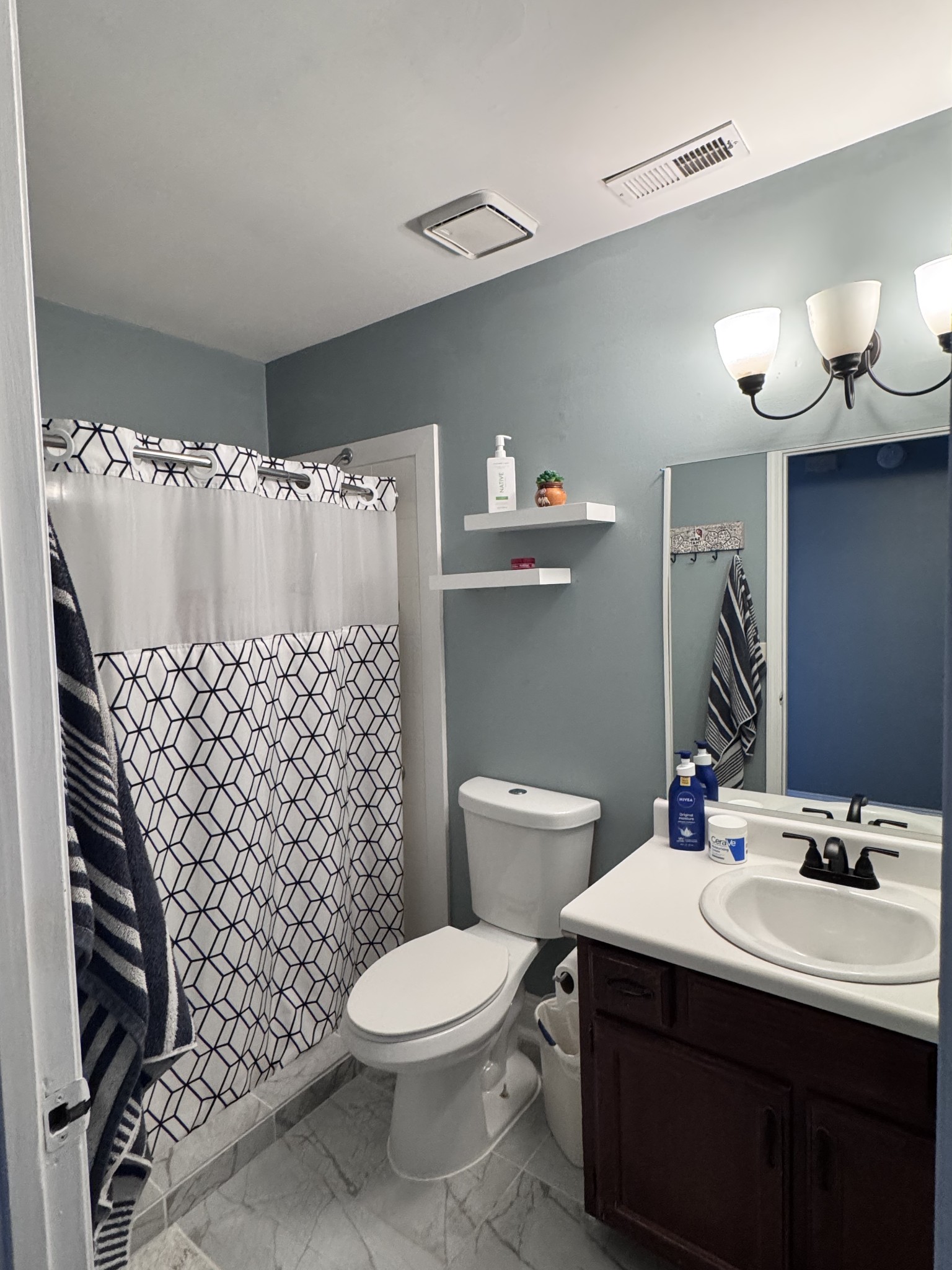 589 Hollandale Road La Vergne, TN 37086 - Photo 14 of 27 a bathroom with a sink mirror vanity and toilet