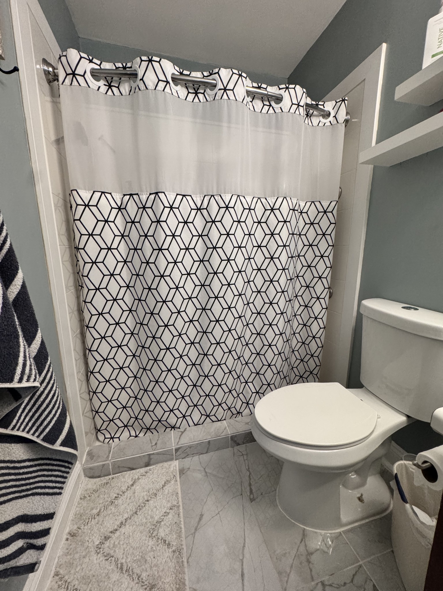 589 Hollandale Road La Vergne, TN 37086 - Photo 15 of 27 a bathroom with a toilet and a shower curtain