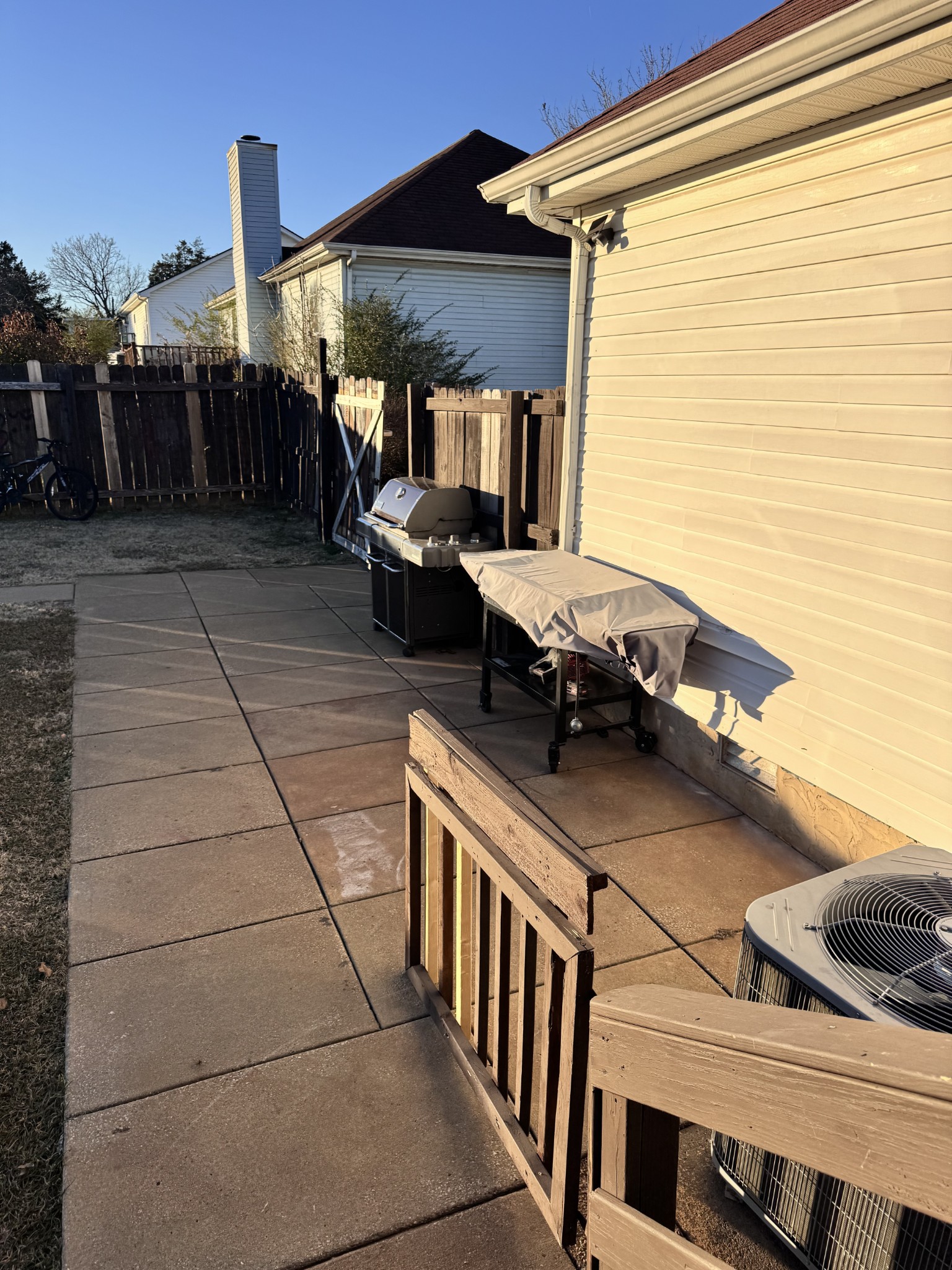 589 Hollandale Road La Vergne, TN 37086 - Photo 21 of 27 a backyard of a house with barbeque oven table and chairs