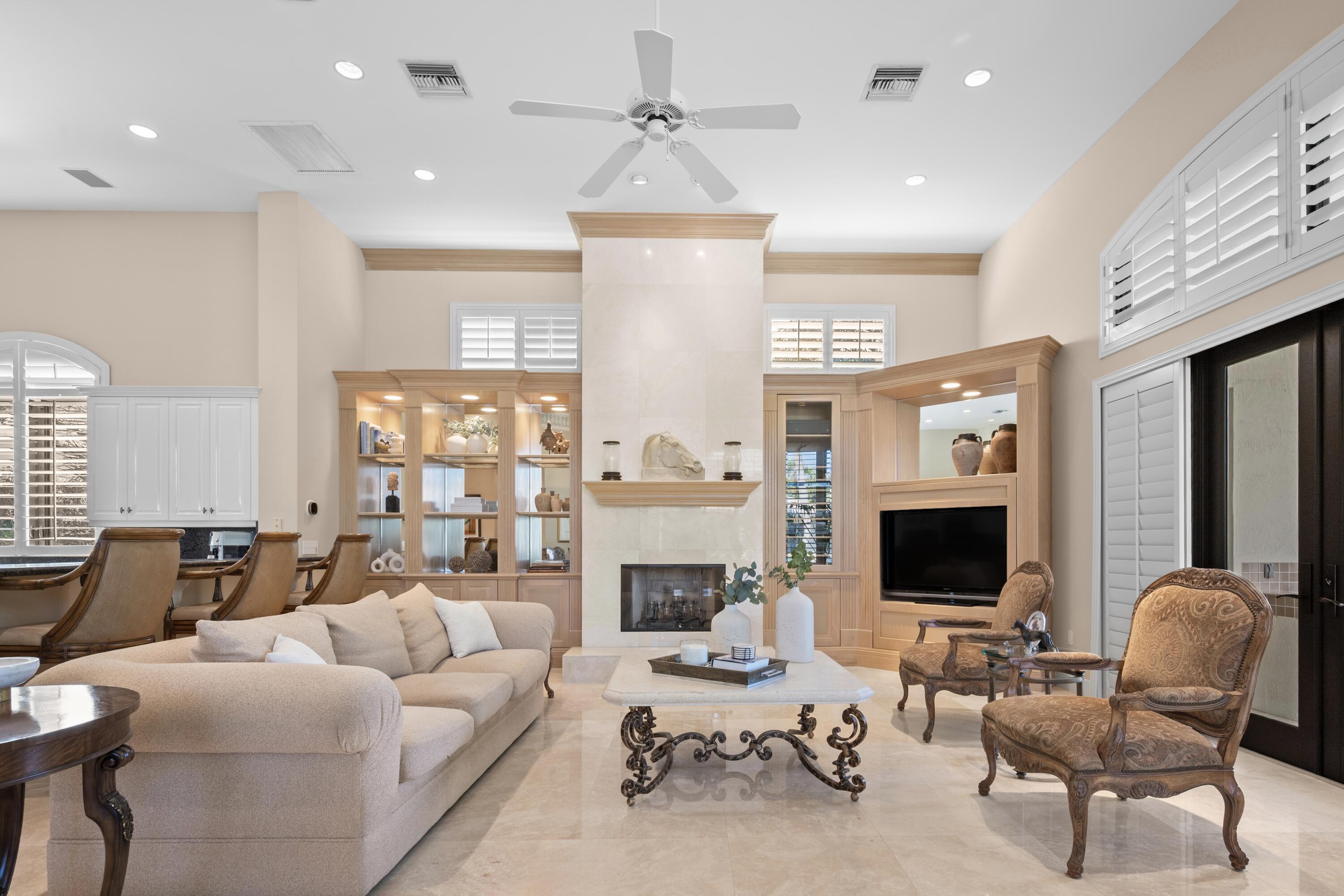 18800 Long Lake Drive Boca Raton, FL 33496 - Photo 21 of 60 a living room with furniture a fireplace and a flat screen tv
