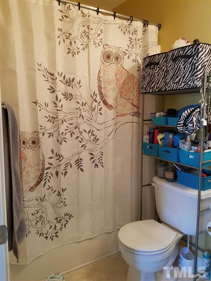 5462 Patuxent Drive Raleigh, NC 27616 - Photo 16 of 25 a bathroom with a toilet and shower