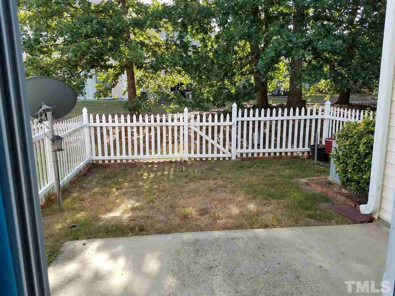5462 Patuxent Drive Raleigh, NC 27616 - Photo 23 of 25 a view of a yard with a fence