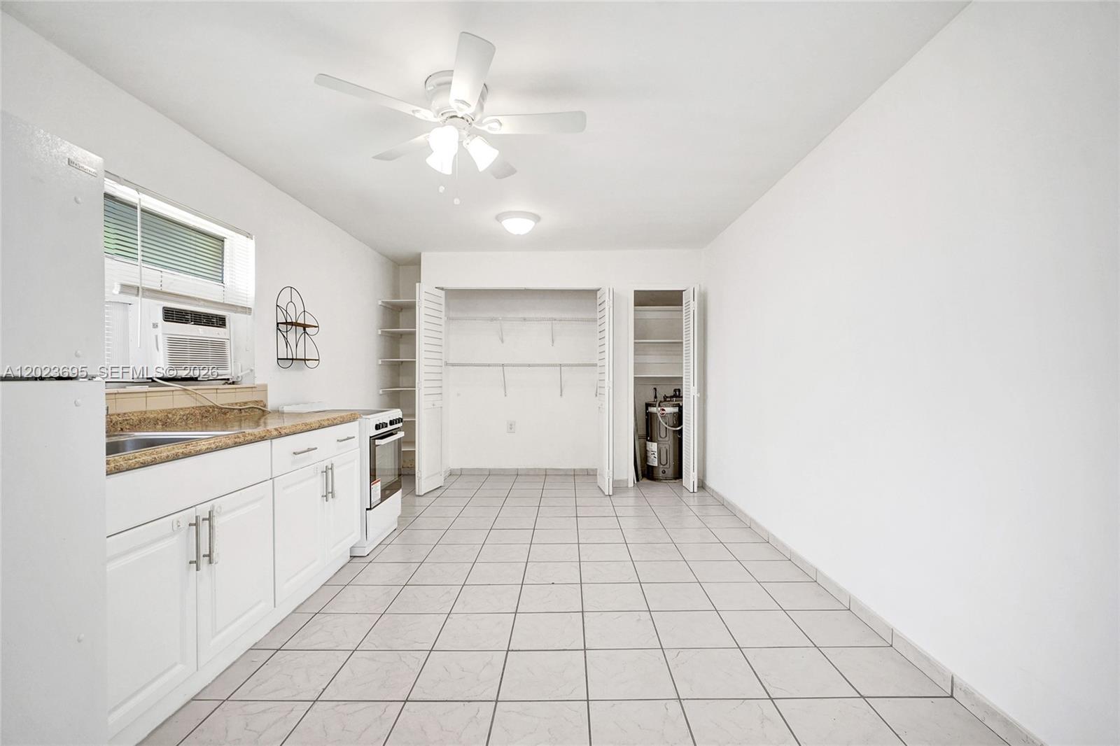 877 West 33rd Street, Unit A Hialeah, FL 33012 - Photo 20 of 36 Kitchen/Family/Dining Area
