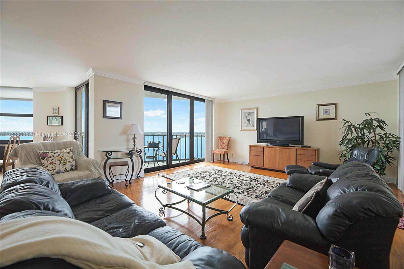 5420 North Ocean Drive, Unit 1205 Riviera Beach, FL 33404 - Photo 11 of 76 a living room with furniture and a flat screen tv