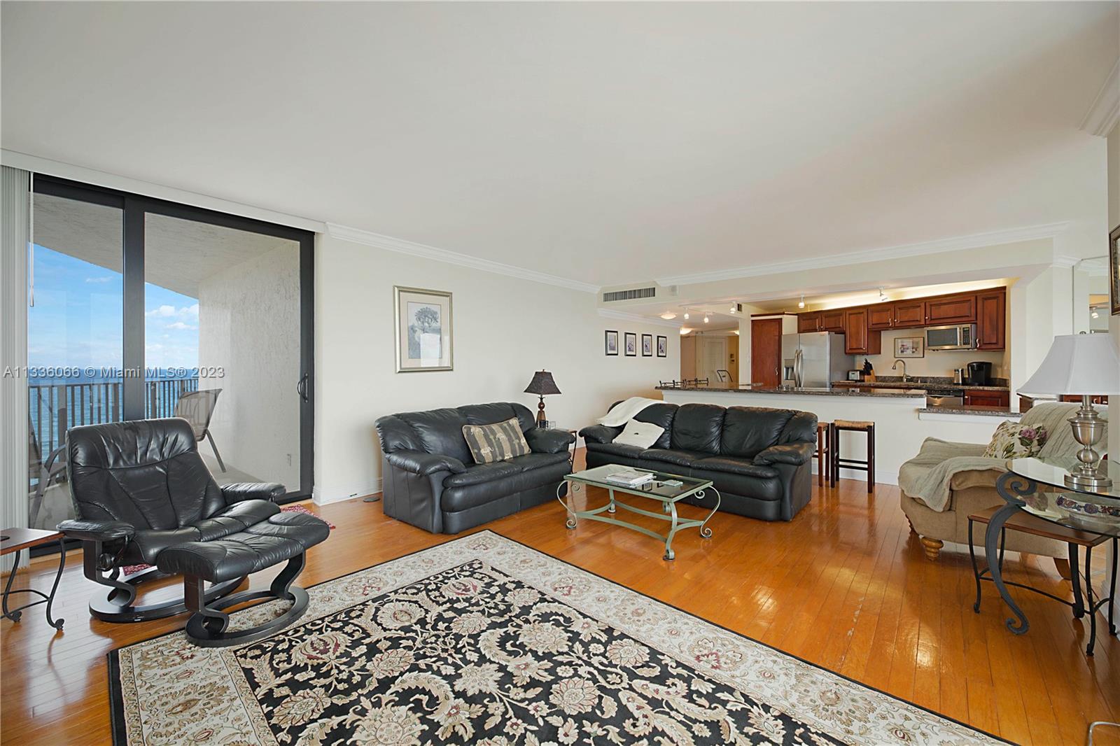 5420 North Ocean Drive, Unit 1205 Riviera Beach, FL 33404 - Photo 14 of 76 a living room with furniture and a rug