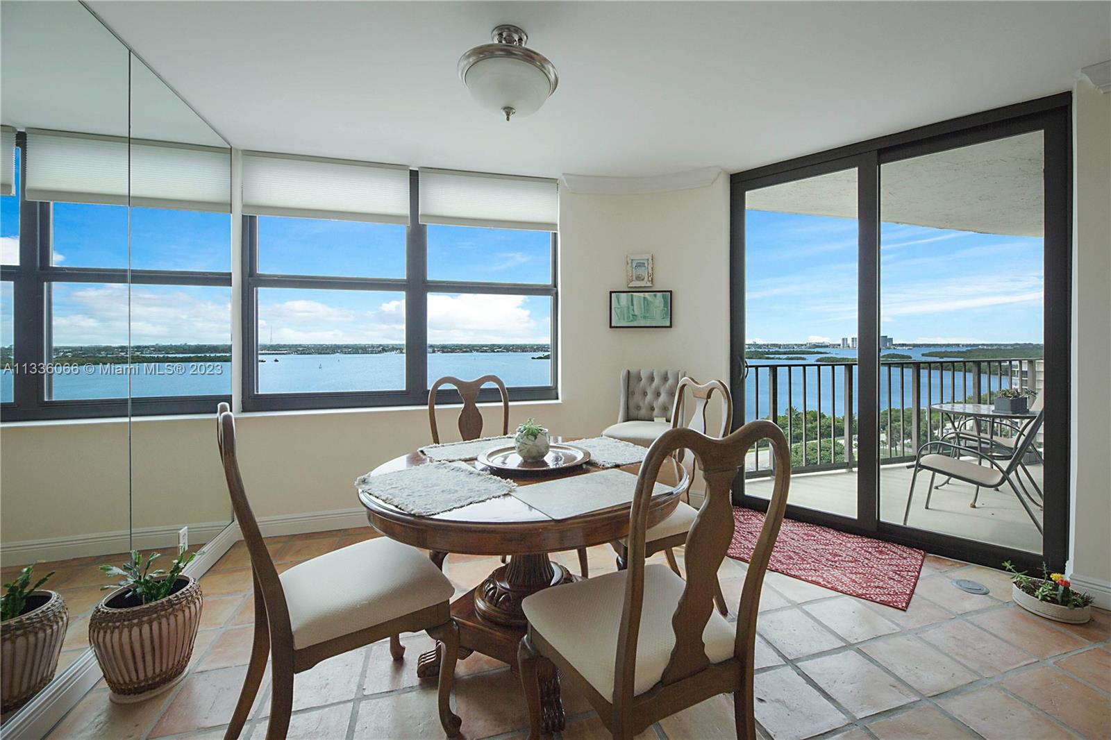 5420 North Ocean Drive, Unit 1205 Riviera Beach, FL 33404 - Photo 18 of 76 a view of a dining room with furniture window and outside view