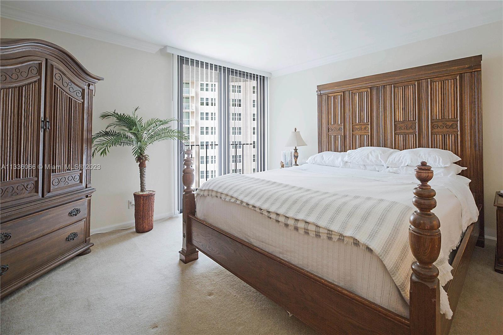 5420 North Ocean Drive, Unit 1205 Riviera Beach, FL 33404 - Photo 20 of 76 a bed sitting in a spacious bedroom next to a window