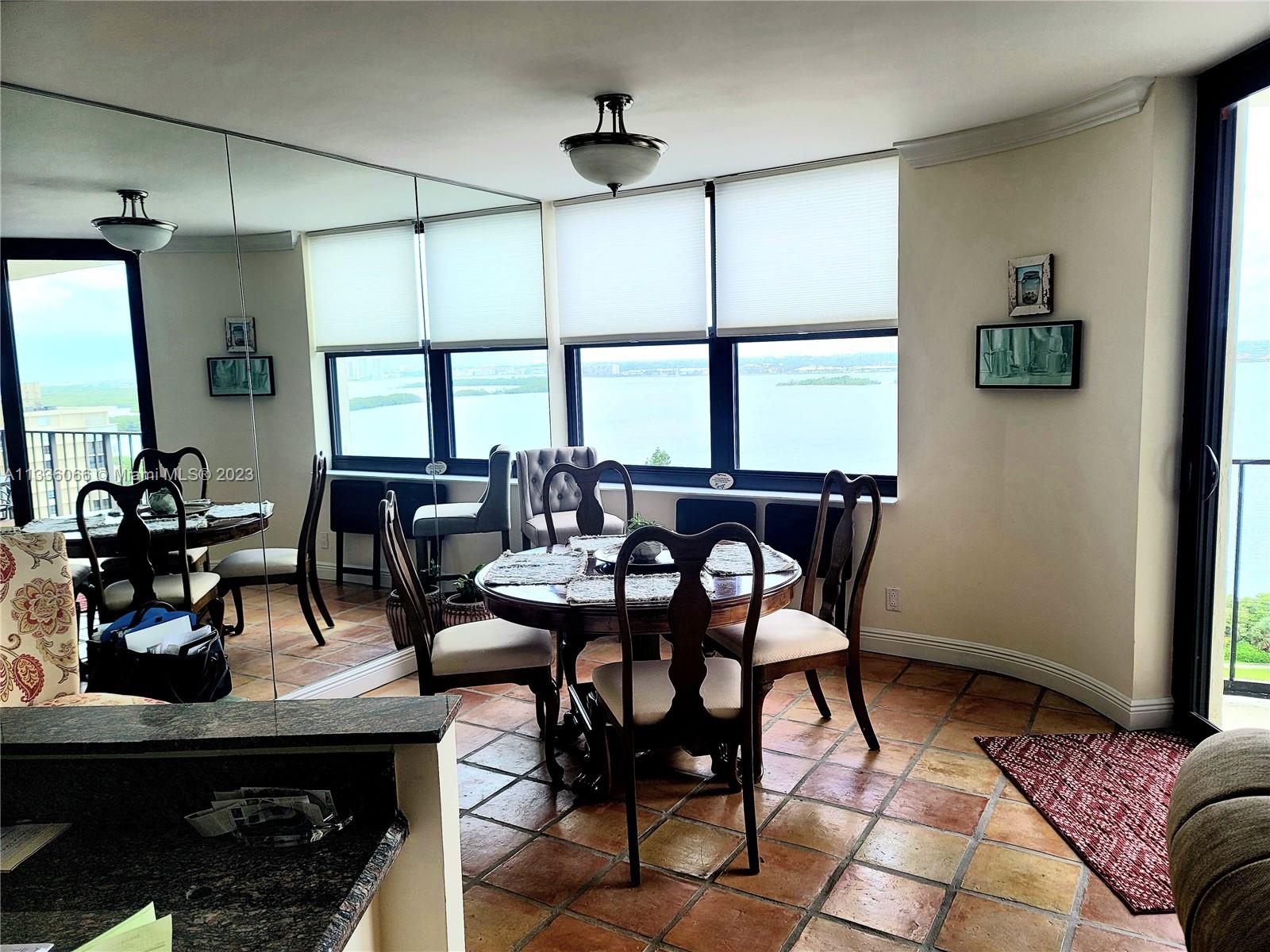5420 North Ocean Drive, Unit 1205 Riviera Beach, FL 33404 - Photo 36 of 76 a view of a dining room with furniture window and outside view