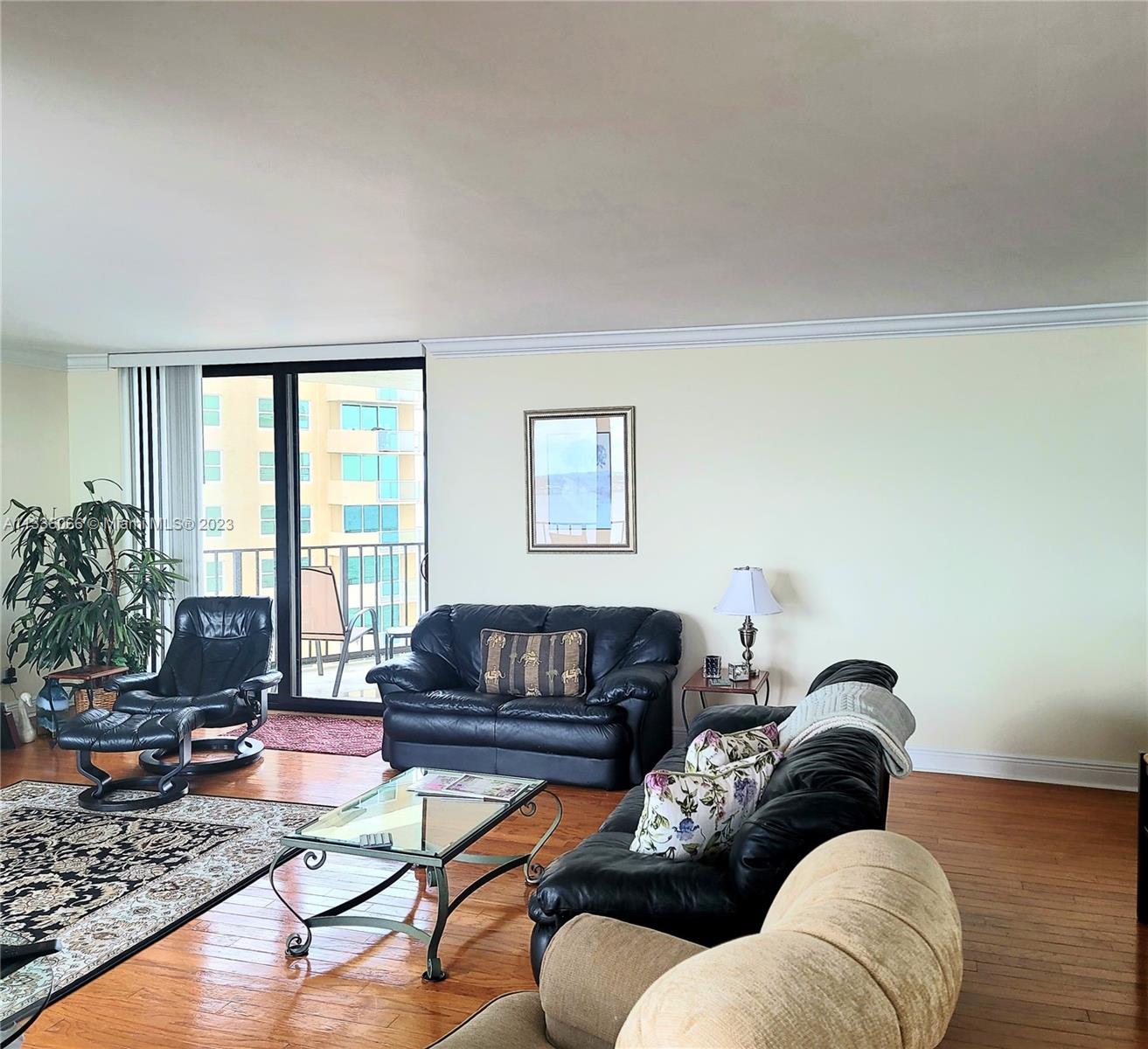 5420 North Ocean Drive, Unit 1205 Riviera Beach, FL 33404 - Photo 37 of 76 a living room with furniture or couch and a potted plant