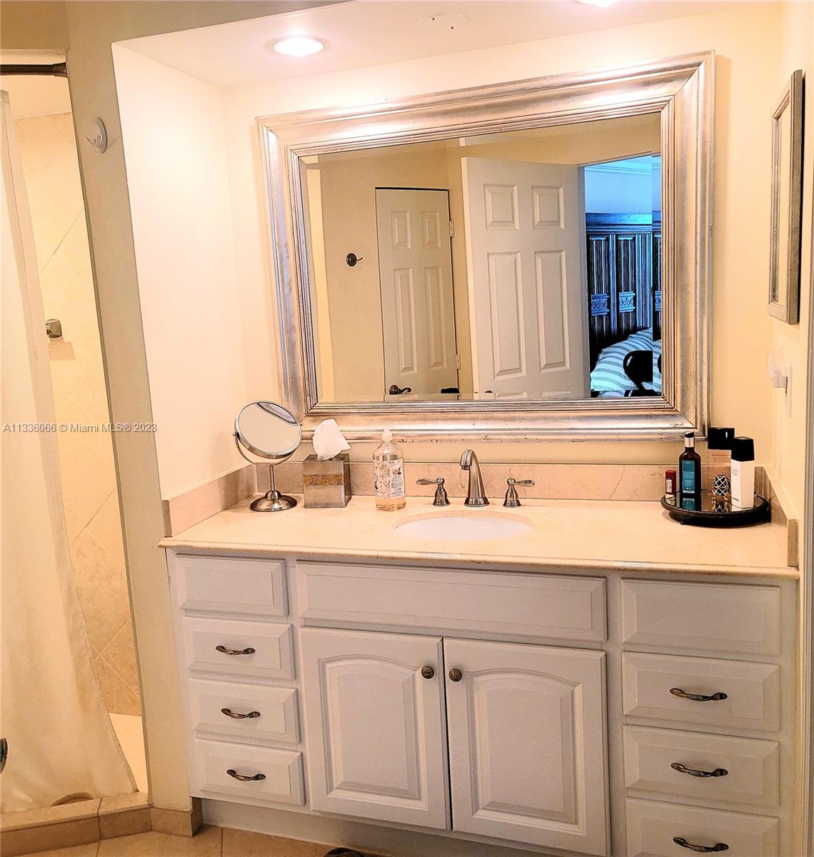 5420 North Ocean Drive, Unit 1205 Riviera Beach, FL 33404 - Photo 40 of 76 a bathroom with a sink vanity and mirror