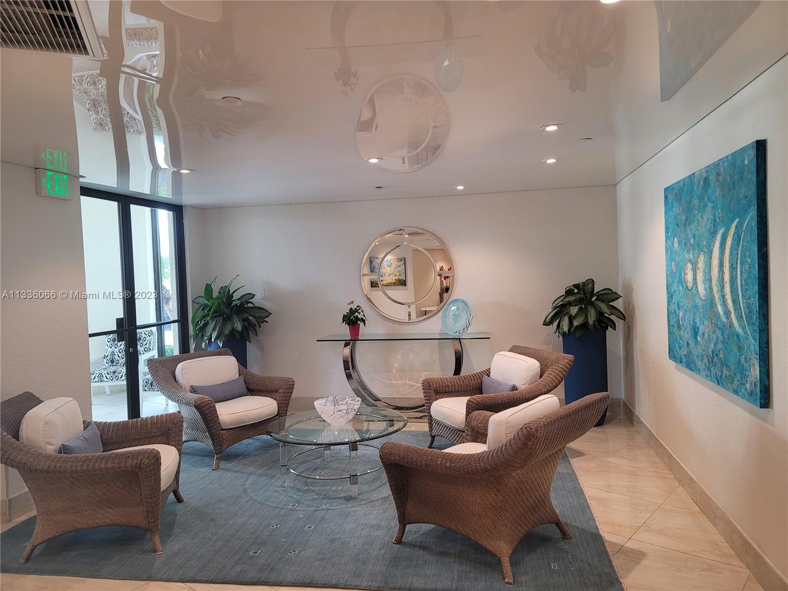 5420 North Ocean Drive, Unit 1205 Riviera Beach, FL 33404 - Photo 52 of 76 a living room with furniture a rug and a large window