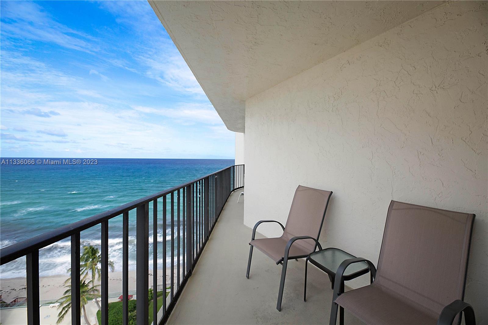 5420 North Ocean Drive, Unit 1205 Riviera Beach, FL 33404 - Photo 6 of 76 a view of a chair and table in the balcony