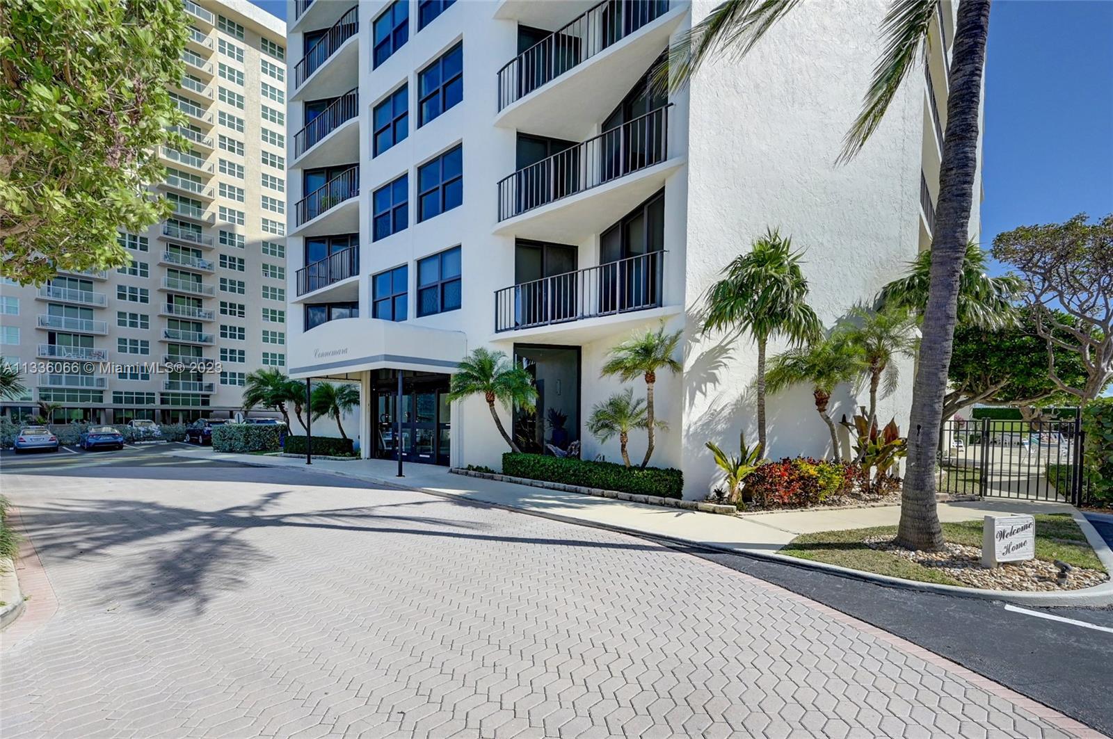 5420 North Ocean Drive, Unit 1205 Riviera Beach, FL 33404 - Photo 69 of 76 a front view of a building with palm trees