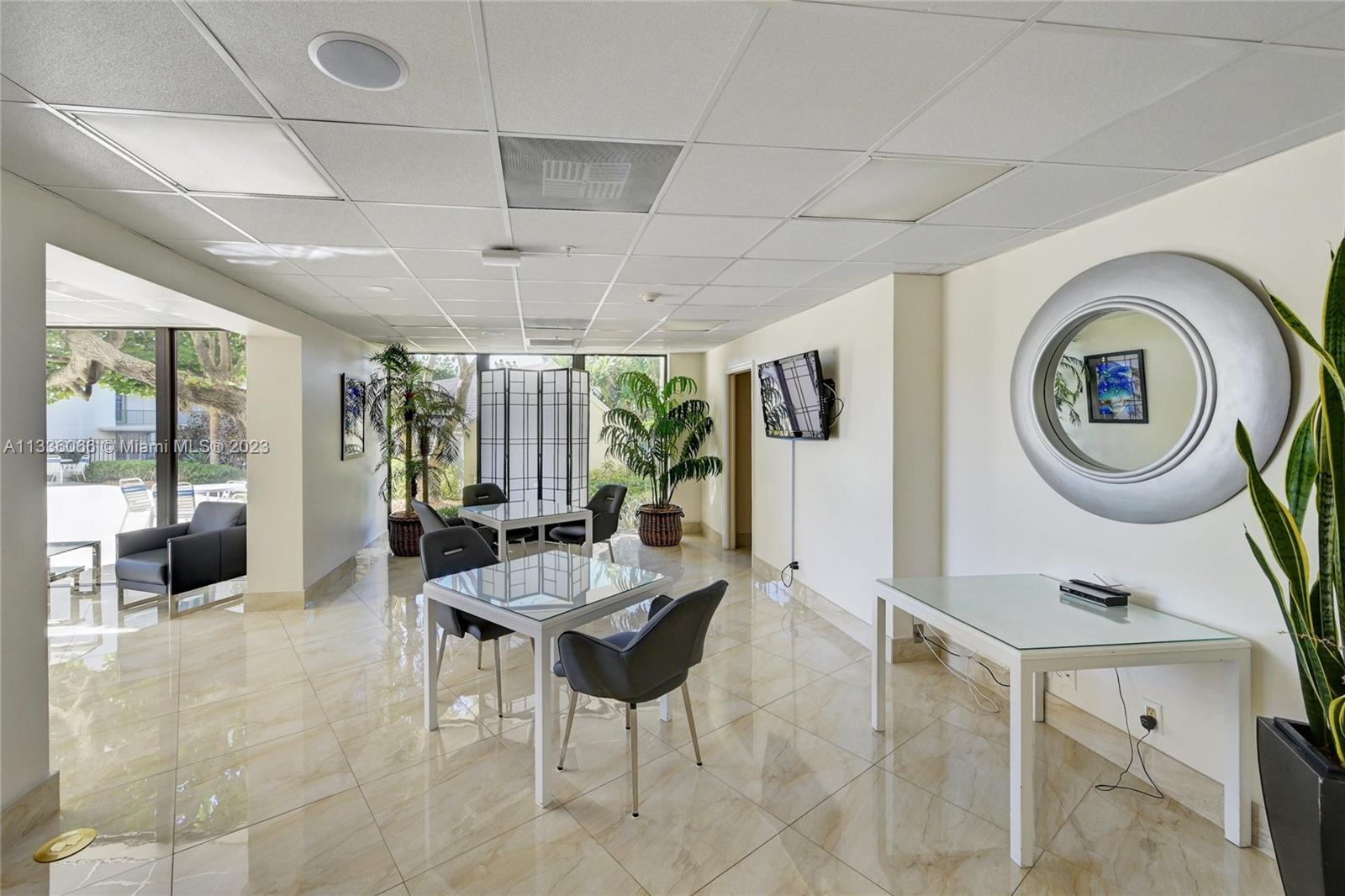 5420 North Ocean Drive, Unit 1205 Riviera Beach, FL 33404 - Photo 71 of 76 a dining room with furniture and a large window
