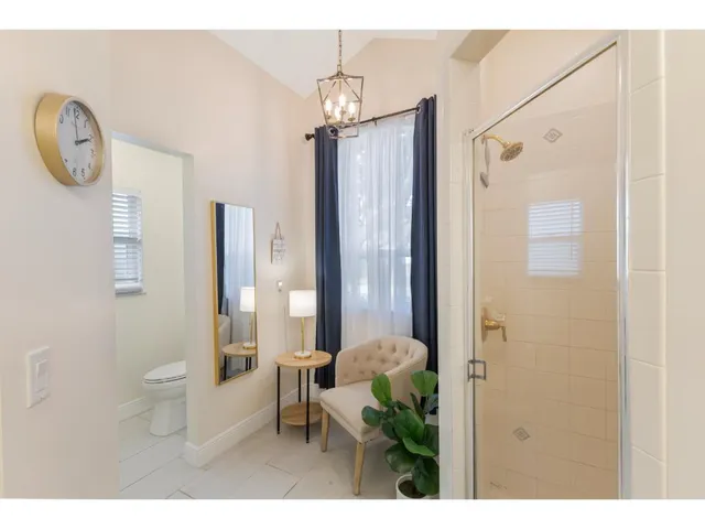 a bathroom with a toilet a sink and a mirror