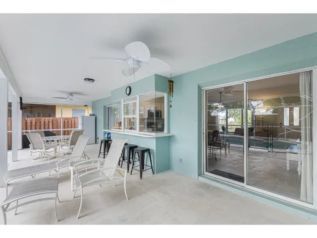 a living room with furniture a window and a table