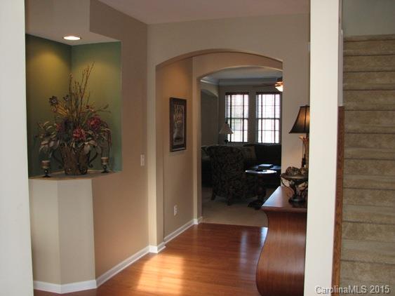 5722 Cactus Valley Road Charlotte, NC 28277 - Photo 3 of 18 a view of a hallway with wooden floor and a bathroom