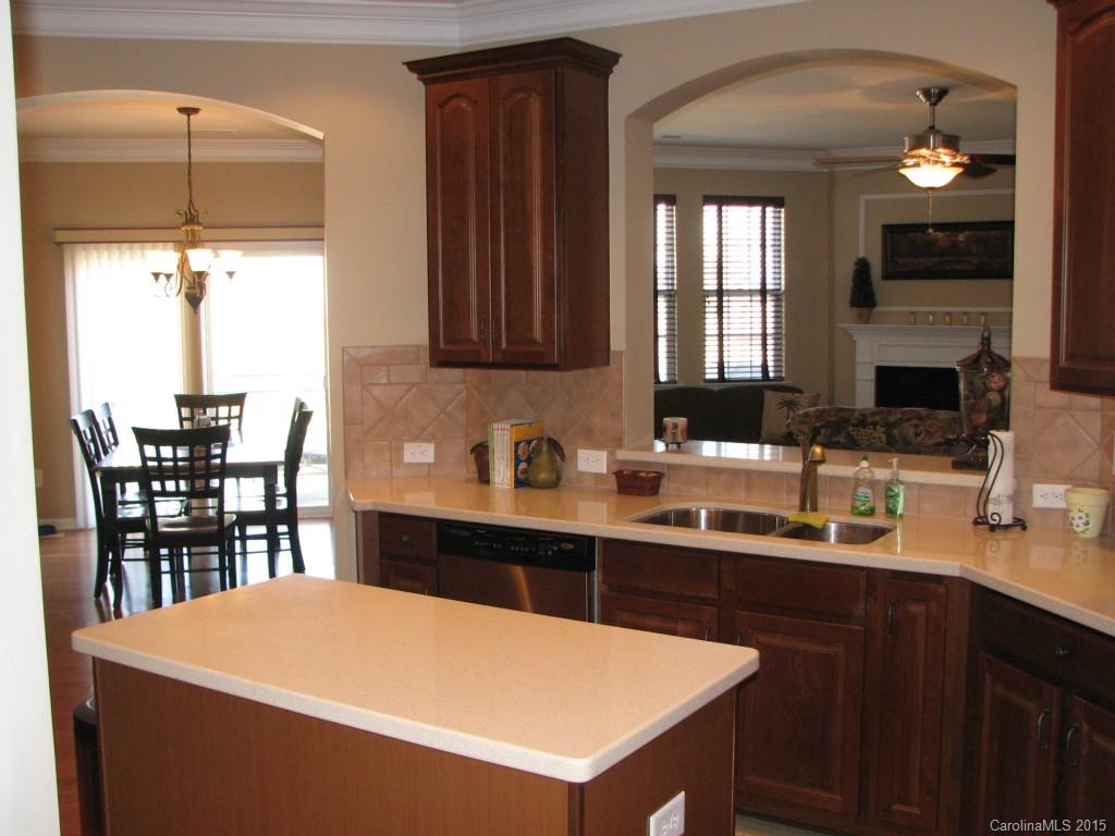 5722 Cactus Valley Road Charlotte, NC 28277 - Photo 5 of 18 a kitchen with a sink a table and chairs