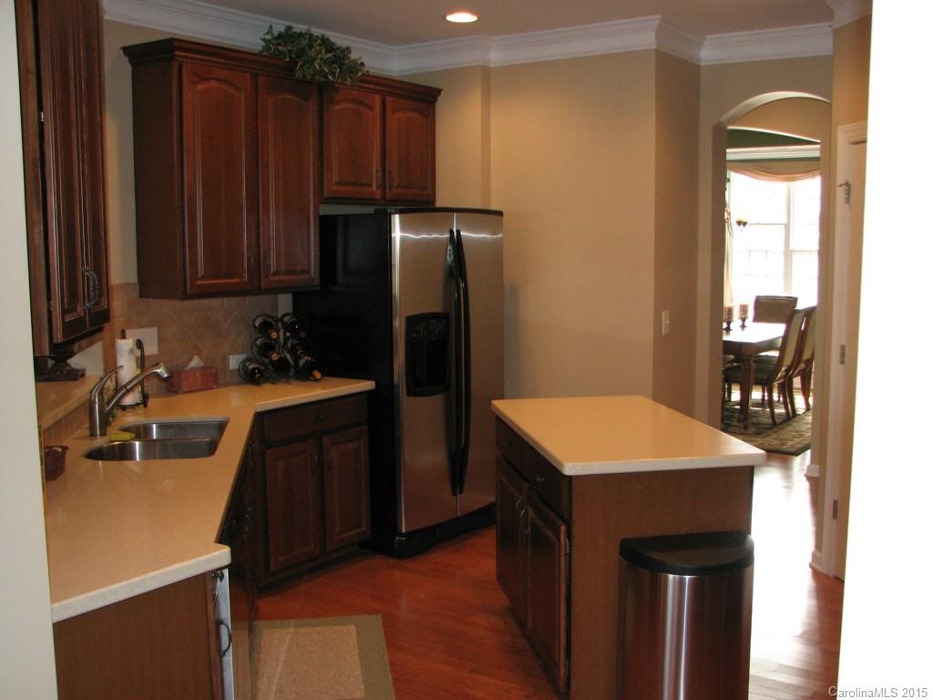 5722 Cactus Valley Road Charlotte, NC 28277 - Photo 6 of 18 a kitchen with refrigerator cabinets and wooden floor