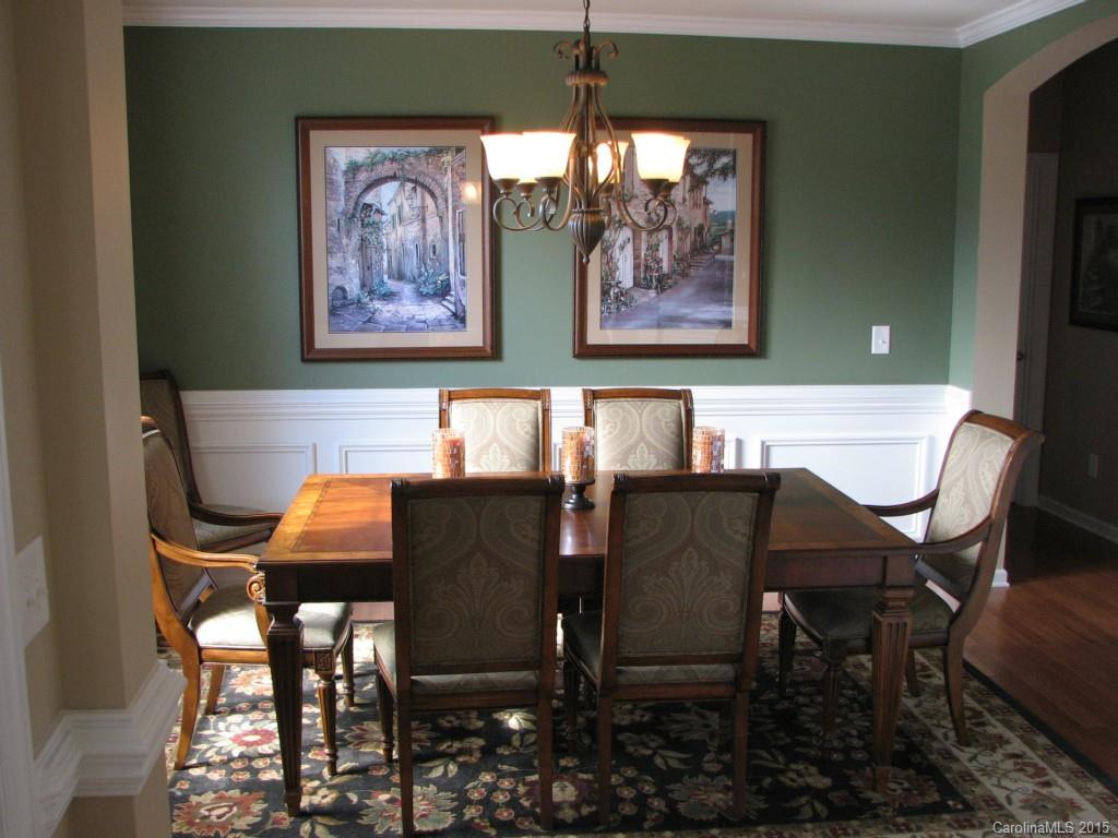 5722 Cactus Valley Road Charlotte, NC 28277 - Photo 8 of 18 a view of a dining room with furniture and a chandelier