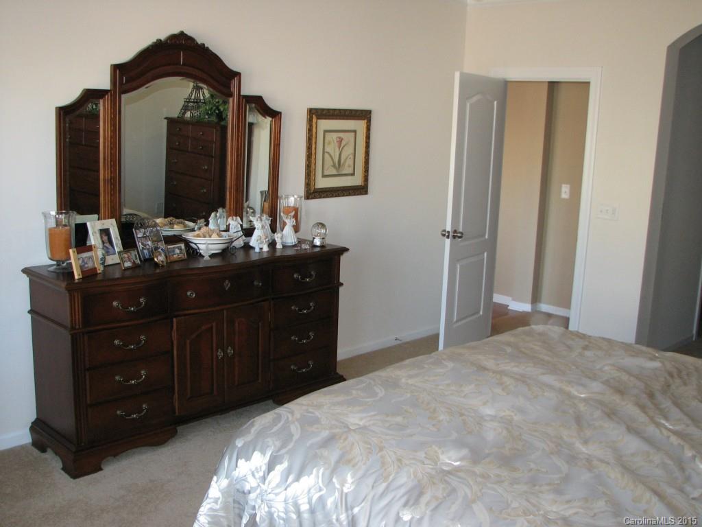 5722 Cactus Valley Road Charlotte, NC 28277 - Photo 10 of 18 a bedroom with a bed and a mirror on dresser