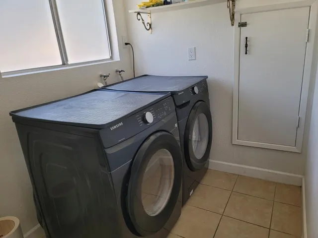 a view of backyard with a table and chair