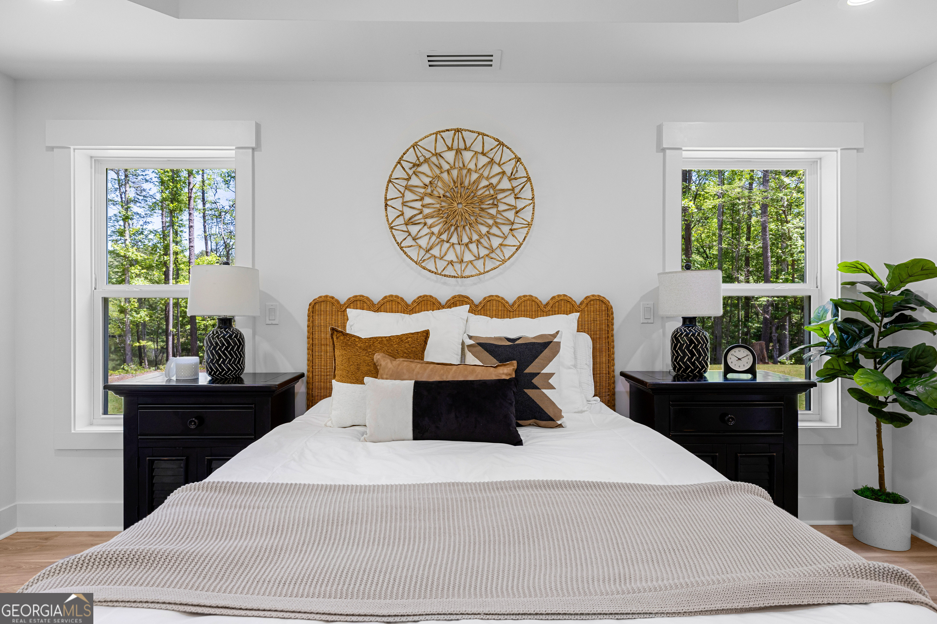 354 Turner Road Newnan, GA 30263 - Photo 39 of 79 a bedroom with a bed and a potted plant