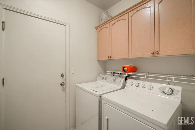 a view of a patio with a table and chairs
