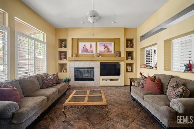 a living room with furniture or couch and a fireplace