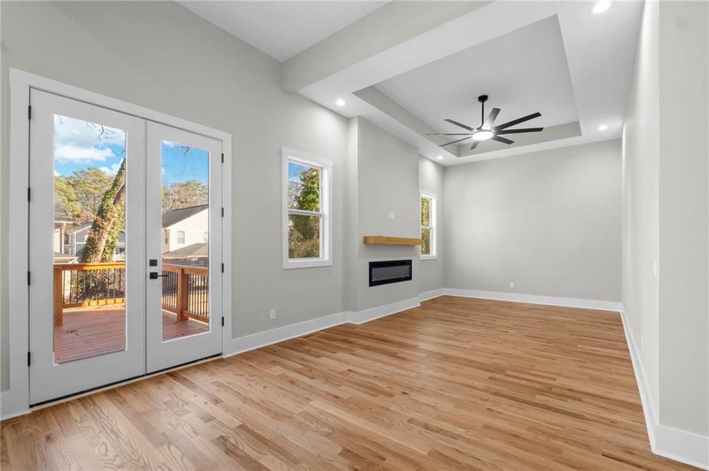 363 Marigna Avenue Scottdale, GA 30079 - Photo 13 of 33 a view of empty room with wooden floor and fan