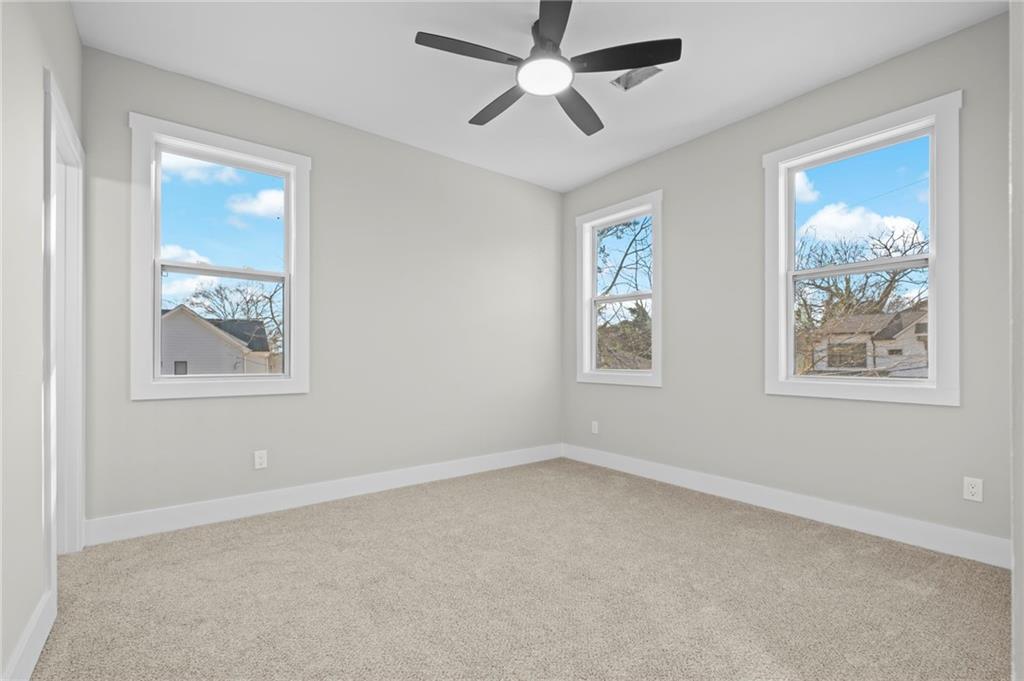 363 Marigna Avenue Scottdale, GA 30079 - Photo 21 of 33 a view of room with window and ceiling fan