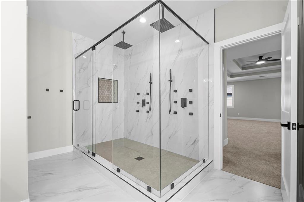 363 Marigna Avenue Scottdale, GA 30079 - Photo 26 of 33 a bathroom that has a glass shower door