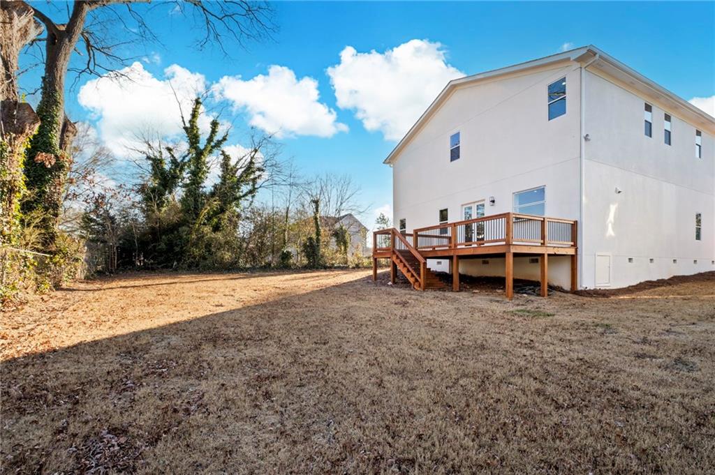 363 Marigna Avenue Scottdale, GA 30079 - Photo 30 of 33 a view of a house with backyard and trees