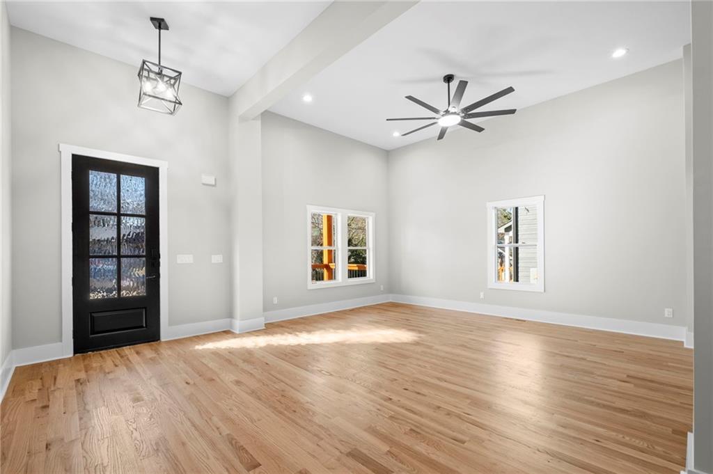 363 Marigna Avenue Scottdale, GA 30079 - Photo 3 of 33 a view of an empty room with window and wooden floor