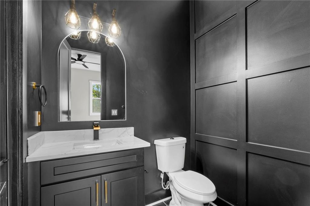 363 Marigna Avenue Scottdale, GA 30079 - Photo 8 of 33 a bathroom with a sink toilet and mirror