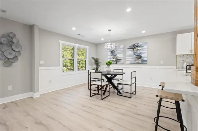 a view of a dining room with furniture window and outside view