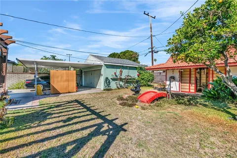 a front view of a house with an outdoor seating