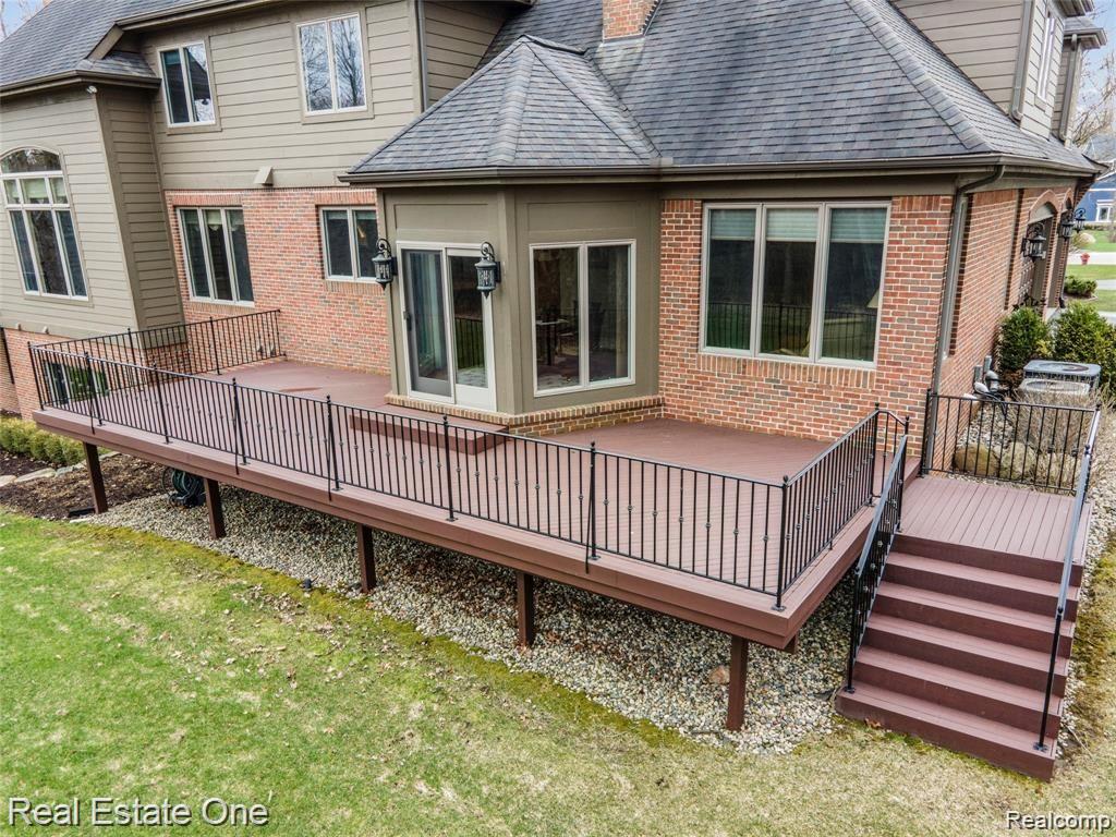 7500 Maple Ridge Drive Clarkston, MI 48346 - Photo 64 of 75 Cedar deck off kitchen for BBQs and relaxation. Freshly treated with stain/preserver in 2021.