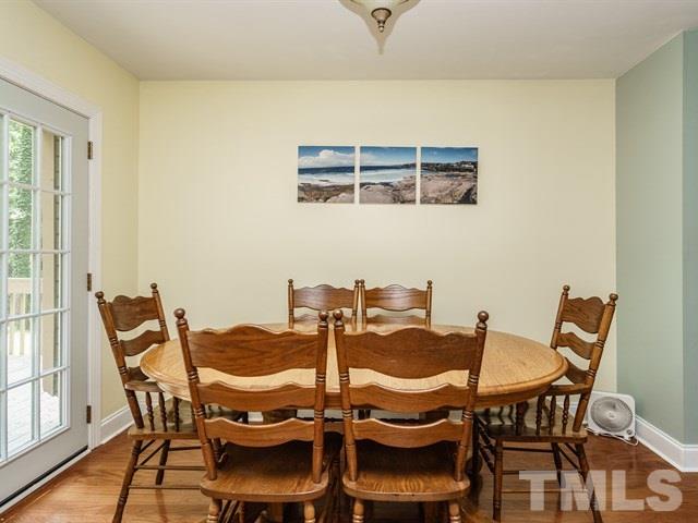 6308 Oakbrook Circle Raleigh, NC 27609 - Photo 6 of 16 Large dining room with sliding glass doors to the huge deck.