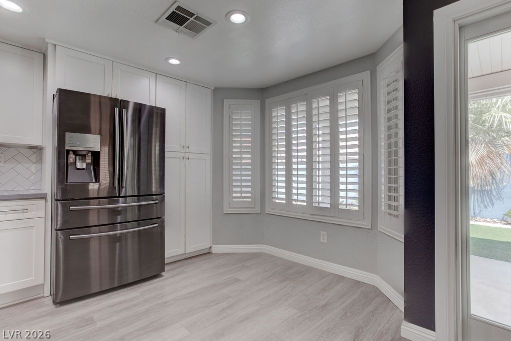 1416 Walstone Road North Las Vegas, NV 89031 - Photo 13 of 47 A well-appointed kitchen features stainless steel appliances and abundant cabinetry, illuminated by recessed lighting.