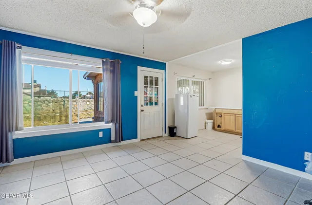 a view of an empty room and window