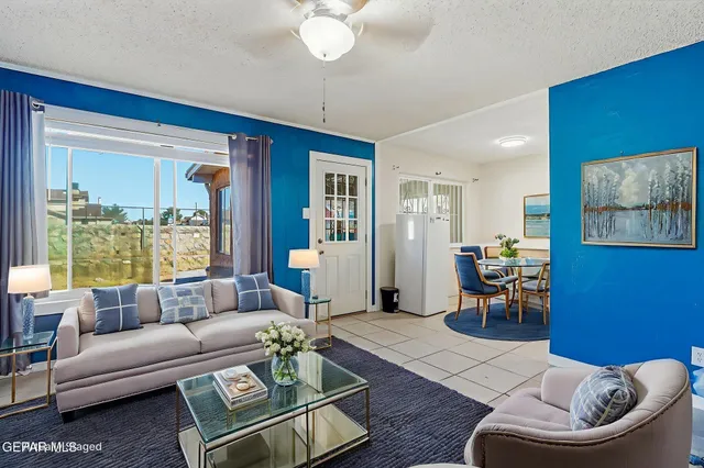 a living room with furniture and a large window