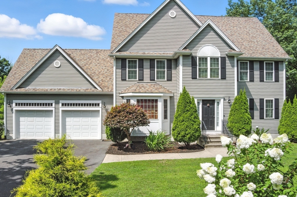 30 Neponset Street Walpole, MA 02071 - Photo 5 of 41 a front view of a house with a yard and porch